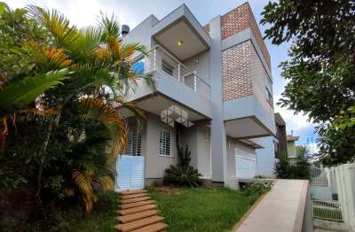 Casa em condomínio fechado com 4 quartos à venda na Rua Ronaldo Molina de Quadros, 100, Mário Quintana, Porto Alegre