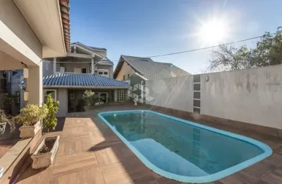 Casa com 4 quartos à venda na Bortolo Barbieri, 67, Jardim São Pedro, Porto Alegre