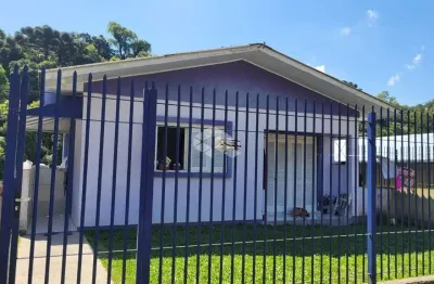 Casa com dois quartos, sala e cozinha, banheiro área de serviço, área total 63 m²