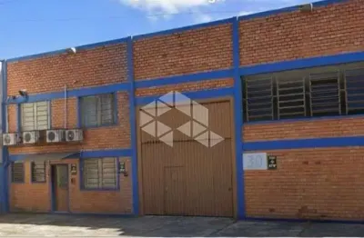 Depósito com 430 m2 com mezanino para escritório com 50 m2 de área, 3 banheiros e 4 vagas localizado no bairro anchieta em porto alegre.