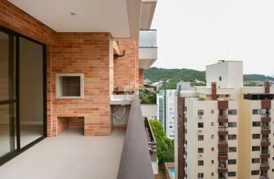 Apartamento semimobiliado com 3 dormitórios sendo 1 suíte, 2 vagas de garagem no bairro itacorubi em florianópolis/sc.