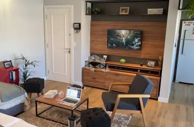 Apartamento com 2 quartos sendo 1 suíte e sacada com churrasqueira em coqueiros florianópolis