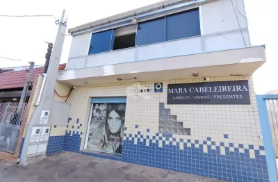 Sobrado com loja comercial e residencia com 3 dormitorios nos fundos na av. a j renner.