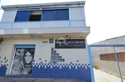 Sobrado com loja comercial e residencia com 3 dormitorios nos fundos na av. a j renner.