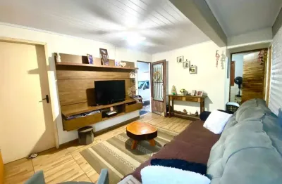 Casa de 3 dormitórios, 2 vagas no bairro Guajuviras em Canoas