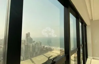 Apartamento com 4 suítes e 4 vagas de garagem em itapema com vista mar