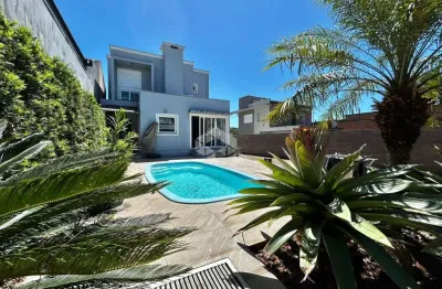 Casa com piscina, suíte e garagem para 5 carros em estância velha