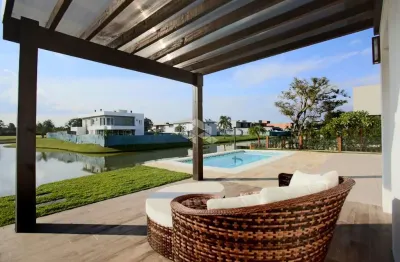 Casa no condomínio ilhas park com cinco suites e  acesso ao rio