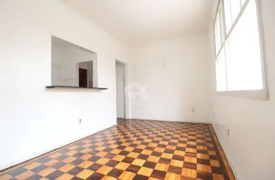 Apartamento de 2 dormitórios reformado no menino deus com estacionamento