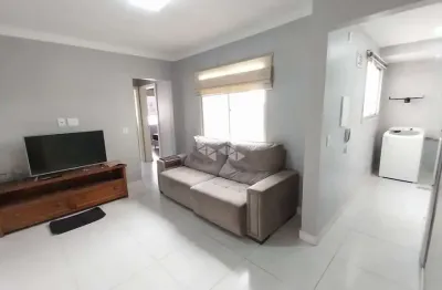 Apartamento com dois dormitórios um lance de escada  e vaga de garagem coberta