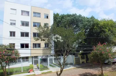 Apartamento dois dormitórios com suite e garagem, em frente a praça