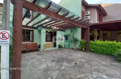 Casa em condomínio fechado com 3 quartos à venda na Avenida Juca Batista, 4095, Hípica, Porto Alegre