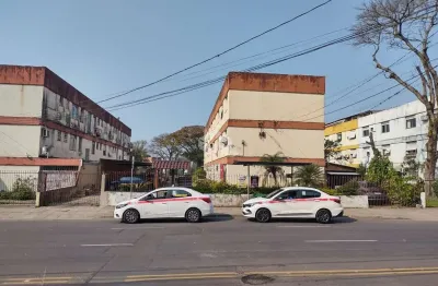 Térreo, amplo apartamento 2 dormitórios e garagem coberta. em frente ao zaffari cestto.