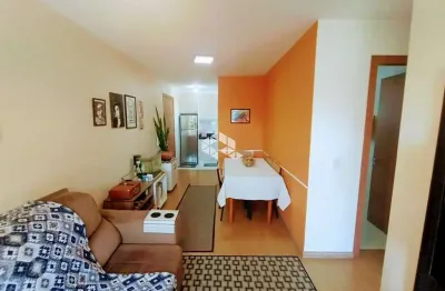 Apartamento semimobiliado com 2 quartos uma vaga de garagem coberta e com 52m, de frente para o por do sol  no bairro charqueadas.