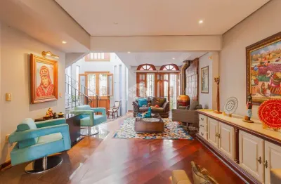 Casa sobrado com 3 dormitórios, 1 suíte e 4 vagas à venda no bairro jardim planalto em porto alegre com 397 m²
