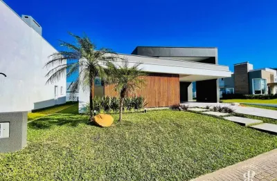 Casa em condomínio fechado dispondo de 04 suítes em tramandaí rs