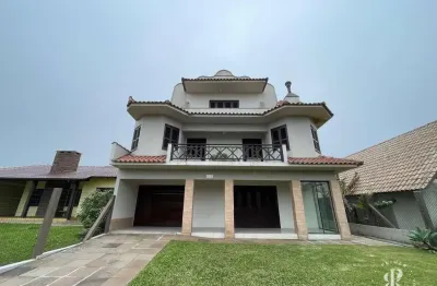 Casa grande com 7 dormitórios próxima a praia de tramandaí