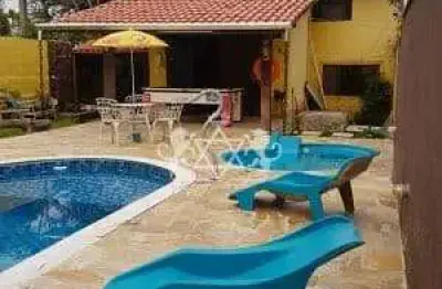Casa à venda vista mar, 04 dormitórios , piscina, espaço gourmet com churrasqueira, praia das palme