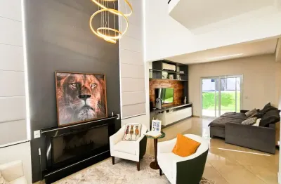 Casa à venda no condominio tarumã com  5 suítes e piscina
