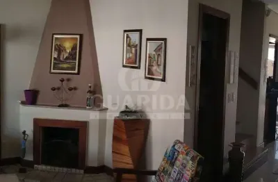 Casa com 3 quartos à venda na rua isidoro bettio, 103, hípica, porto alegre por r$ 500.000