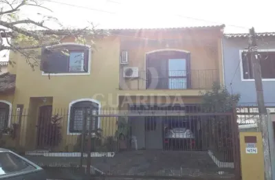 Casa com 3 quartos à venda na rua andré primo biazetto, 414, campo novo, porto alegre por r$ 1.100.000
