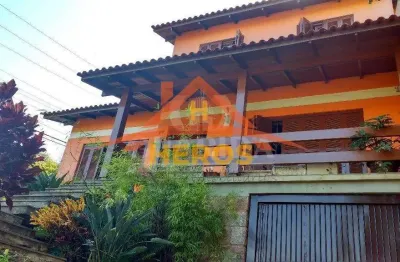 Casa com 5 quartos à venda na rua ângelo passuelo, 79, vila nova, porto alegre por r$ 650.000