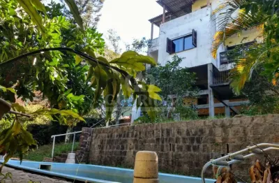 Casa com 5 quartos à venda na avenida vicente monteggia, 2231, cavalhada, porto alegre por r$ 899.000