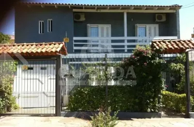 Casa com 4 quartos à venda na rua giruá, 63, cavalhada, porto alegre por r$ 990.000