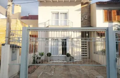 Casa com 3 quartos à venda na rua wilson conceição bona, 104, hípica, porto alegre por r$ 580.000
