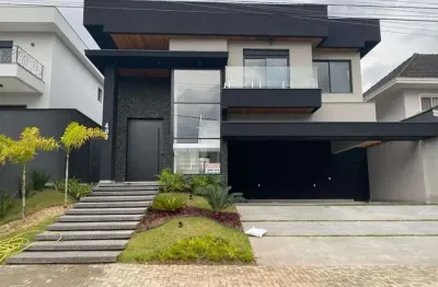 Casa à venda, belíssima arquitetura, 4 suítes, no condomínio jaguary!