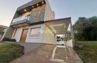 Casa em condomínio fechado com 3 quartos à venda na avenida luigi lucchese, 440, loteamento jardim timbaúva, gravataí, 150 m2 por r$ 899.000