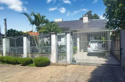 Casa com 3 quartos à venda na Rua Norberto Peixoto, 200, Dom Feliciano, Gravataí, 106 m2 por R$ 1.100.000
