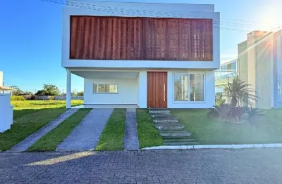 Linda casa em condominio fechado,acesso ao rio mampituba em passo de torres sc