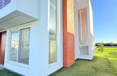 Linda casa em condominio fechado,acesso ao rio mampituba em passo de torres sc