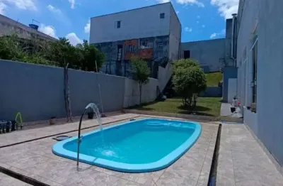 Lindo imóvel residencial ou comercial com salão de festas, terreno inteiro com piscina e ótima localização