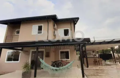 Casa em condomínio fechado com 3 quartos à venda na rua san conrado, 415, loteamento caminhos de san conrado (sousas), campinas, 344 m2 por r$ 1.800.000