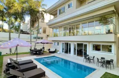 Casa em condomínio fechado com 4 quartos à venda na Alameda das Sibipirunas, Alphaville, Santana de Parnaíba