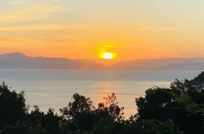 Terreno em condomínio fechado à venda na rodovia haroldo soares glavan, 910, cacupé, florianópolis por r$ 1.970.000