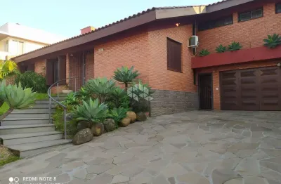 Casa com 4 quartos à venda na Rua Professor Fernando Carneiro, 287, Três Figueiras, Porto Alegre