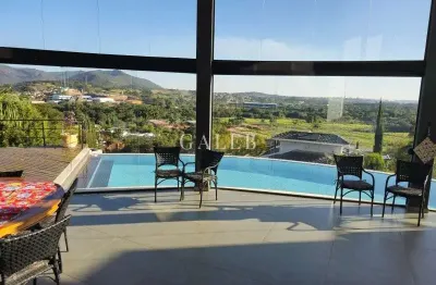 Casa de luxo em condomínio: 3 quartos, 3 suítes, 4 salas, 6 banheiros, 12 vagas de garagem e 564m² em atibaia-sp.