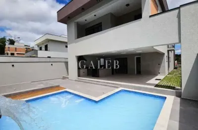 Sobrado à venda em condomínio dentro da cidade, 4 suítes, piscina e fireplace