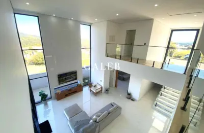 Luxuosa casa no condomínio serra da estrela com 5 suítes e uma vista deslumbrante