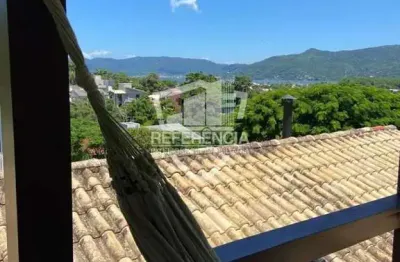 Casa com piscina e vista para a lagoa na barra da lagoa – escritura pública! 