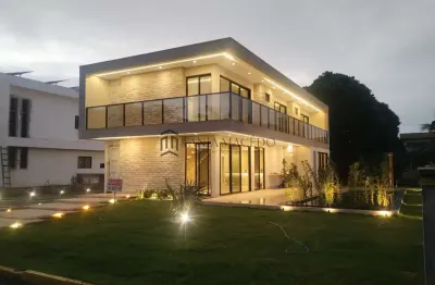 Casa  terra perla venata,  mobiliada com área total de 627 m2 e 370m² de área construída, 4 suítes