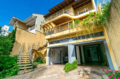 Casa em condomínio fechado com 5 quartos à venda na rua isidoro tressi, 507, jardim botânico, porto alegre por r$ 1.550.000