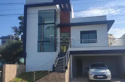 Casa em condomínio fechado com 3 quartos à venda na rua antônio ramos, 440, loteamento jardim timbaúva, gravataí por r$ 1.090.000