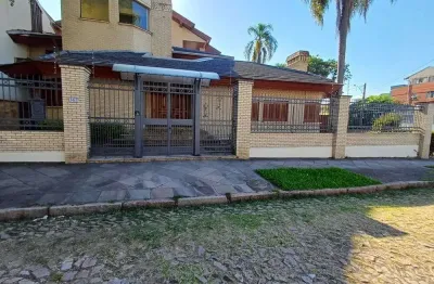 Casa com 4 quartos à venda na Rua Paissandu, 361, Partenon, Porto Alegre