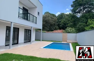 Casa nova em condomínio fechado ,  04 suites com piscina