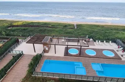 Apartamento com dois quartos frente mar pé na areia semi mobiliado