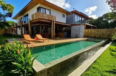 Casa de alto padrão com 5 suítes à venda, porteira fechada, no condomínio praia bella com acesso privativo à praia, localizado na praia do forte - bahia -